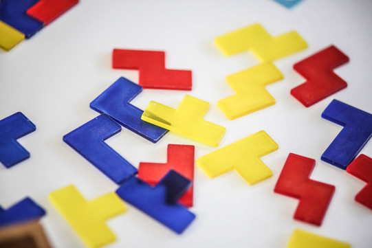 Colorful plastic tiles Colorful plastic plates in different shapes.